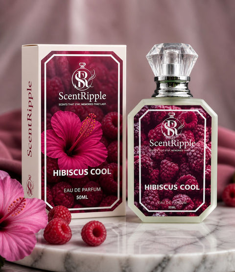 ScentRipple Hibiscus Cool perfume bottle and packaging on a marble surface with pink flowers and raspberries.